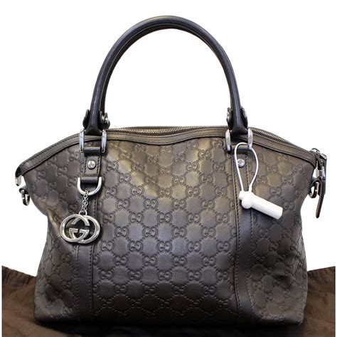 gucci black and brown handbag.